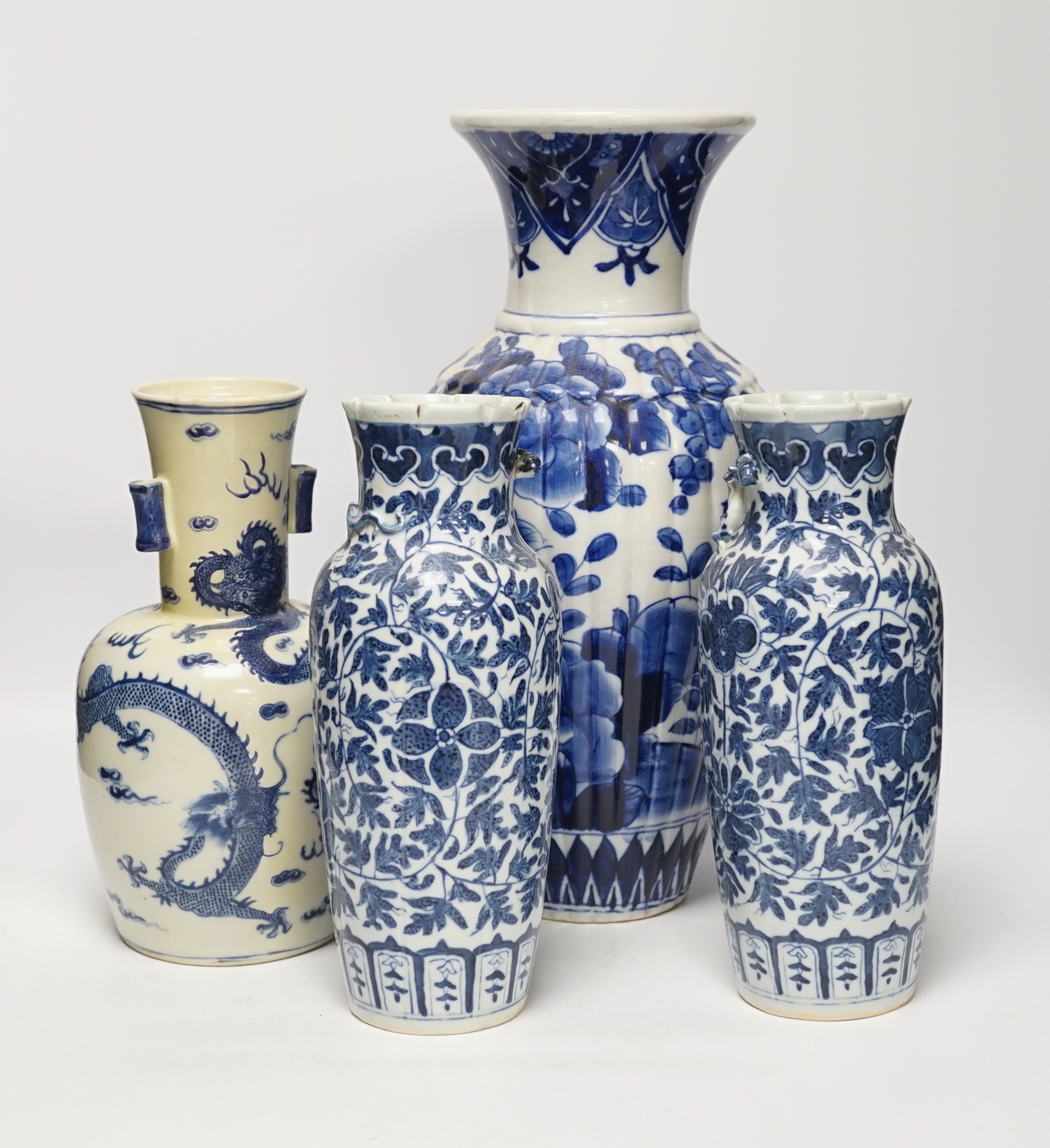 Three 19th century Chinese blue and white vases including a floral pair and a Japanese vase, largest 39cm high